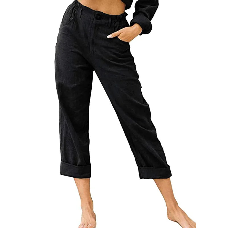 Model wearing Echo & Air women's Linen Cotton Crop Pants in black showcasing the relaxed fit, comfortable side pocket, and rolled cuffs