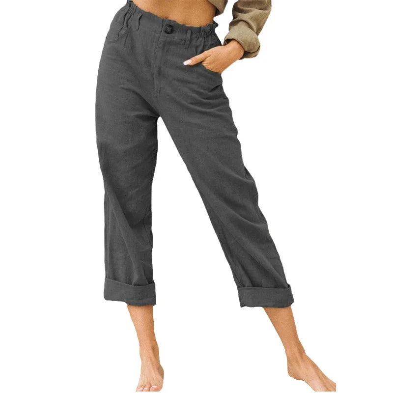 Model wearing Echo & Air women's Linen Cotton Crop Pants in dark gray showcasing the relaxed fit, comfortable side pocket, and rolled cuffs.