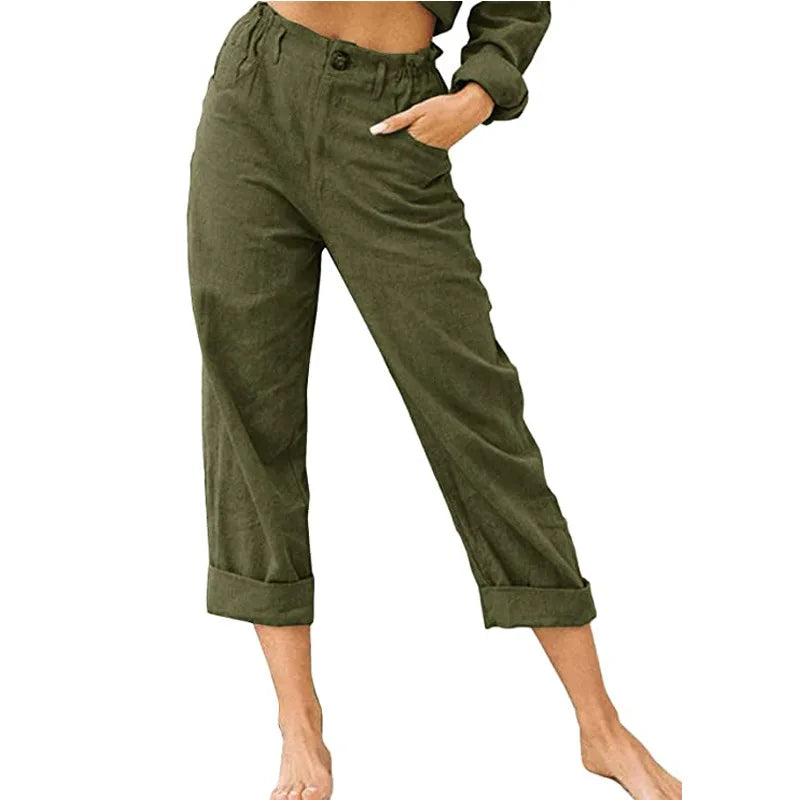 Model wearing Echo & Air women's Linen Cotton Crop Pants in green showcasing the relaxed fit, comfortable side pocket, and rolled cuffs.