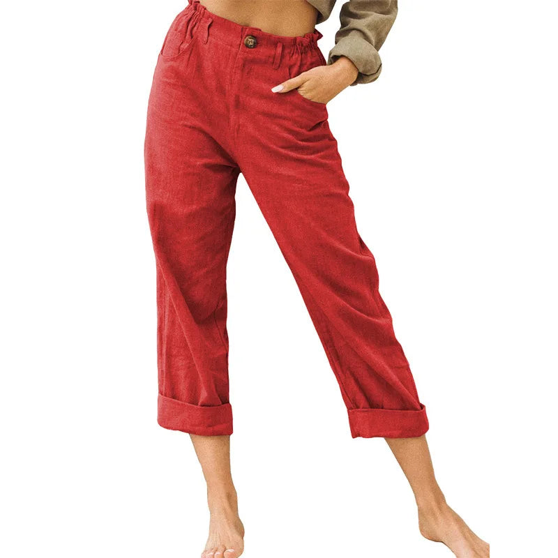 Model wearing Echo & Air women's Linen Cotton Crop Pants in red showcasing the relaxed tapered harem fit, comfortable side pockets, and rolled cuffs.