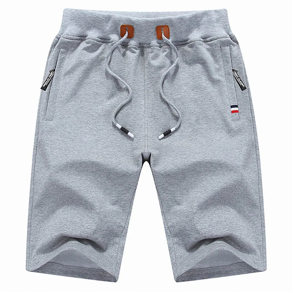 Light grey men's cotton drawstring shorts with an adjustable waistband and secure side-zip pockets by Echo & Air.