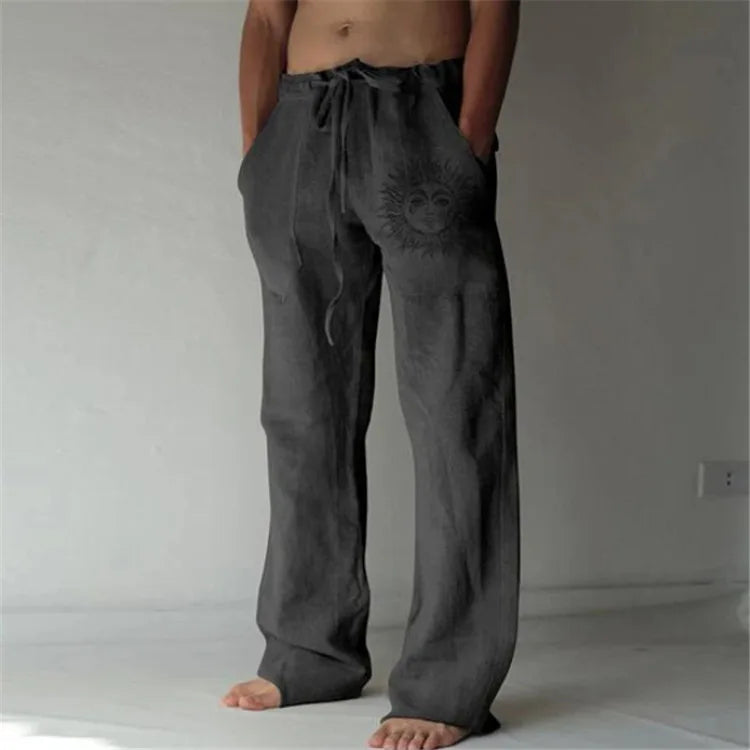 Model wearing Echo & Air men's Driftwood Slit Lounge Pant in dark grey.