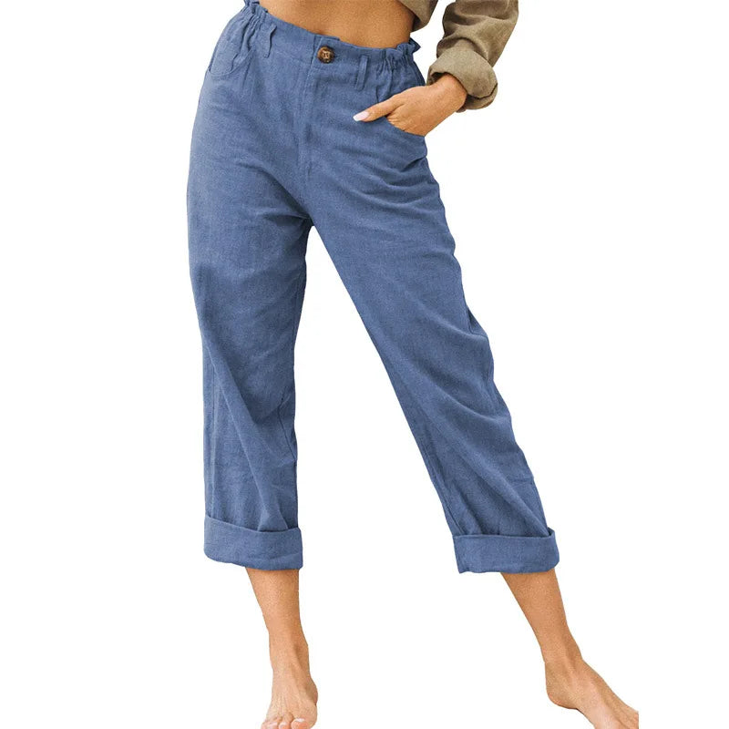 Model wearing Echo & Air women's Linen Cotton Crop Pants in blue showcasing the relaxed tapered harem fit, comfortable side pockets, and rolled cuffs.